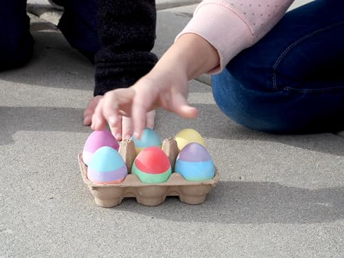 child hand reaching for egg shaped chalk